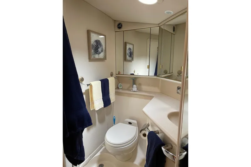 Slide: The Image of Bathroom interior of 2003 Sea Ray 550 Sundancer yacht, featuring modern fixtures and elegant decor. - 34