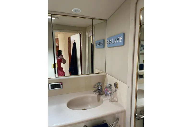Slide: The Image of Bathroom interior of 2003 Sea Ray 550 Sundancer yacht with mirror and sink. - 35
