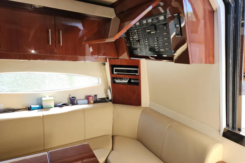 Slide: The Image of Interior of 2013 Regal 42 Sport Coupe with leather seating and control panel. - 11