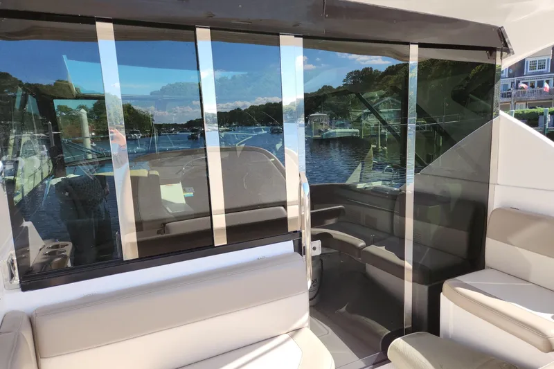 Slide: The Image of Interior view of 2013 Regal 42 Sport Coupe yacht with scenic waterway reflection. - 15