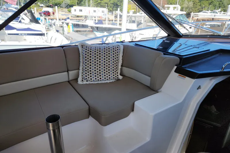 Slide: The Image of Interior seating of 2013 Regal 42 Sport Coupe yacht with cushion, docked at marina. - 16