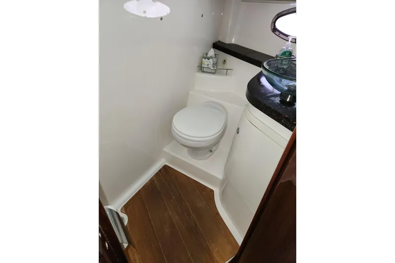 Slide: The Image of 2013 Regal 42 Sport Coupe bathroom with modern fixtures and wooden flooring. - 17