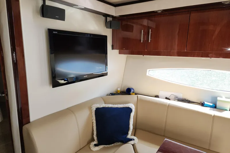 Slide: The Image of Luxurious interior of 2013 Regal 42 Sport Coupe with TV and plush seating. - 20