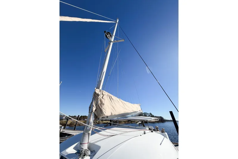 Slide: The Image of Sailboat mast of 2005 Lagoon 380 S2 against clear blue sky. - 18