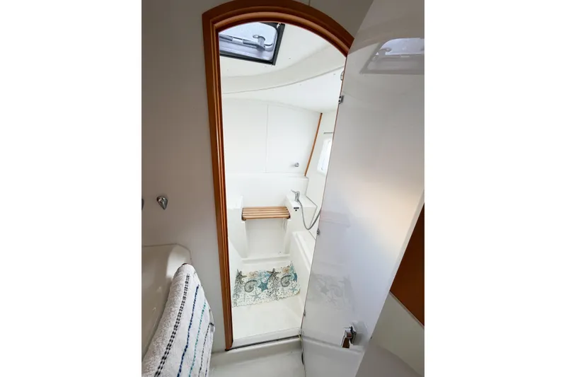 Slide: The Image of Interior of 2005 Lagoon 380 S2 yacht bathroom with shower and skylight. - 45