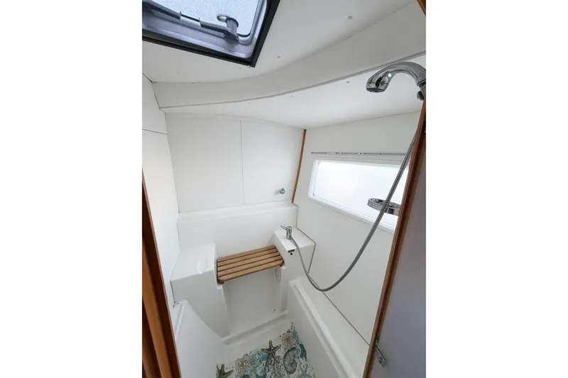 Slide: The Image of Bathroom interior of 2005 Lagoon 380 S2 yacht with shower and window. - 46