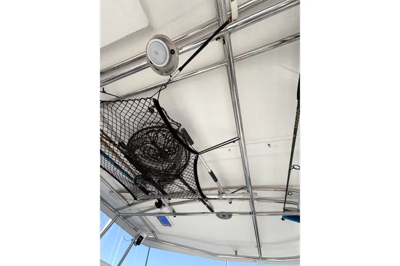 Slide: The Image of Ceiling view of 2005 Lagoon 380 S2 catamaran with fishing gear and net storage. - 86