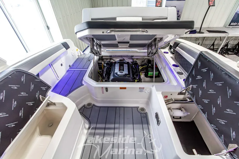 Slide: The Image of 2026 Chaparral SSX 6 boat engine compartment with open hatches and visible components. - 14