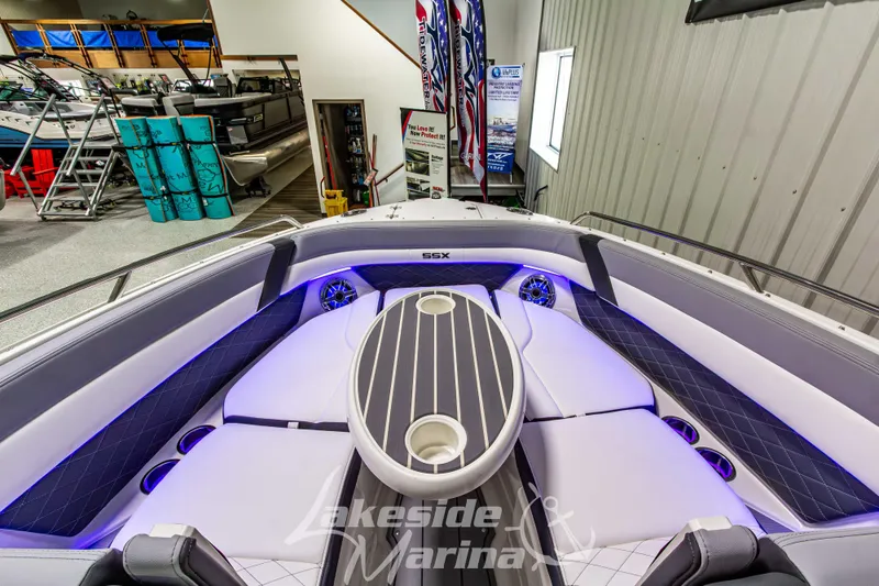Slide: The Image of 2026 Chaparral SSX 6 boat interior with modern seating and ambient lighting at Lakeside Marina. - 32