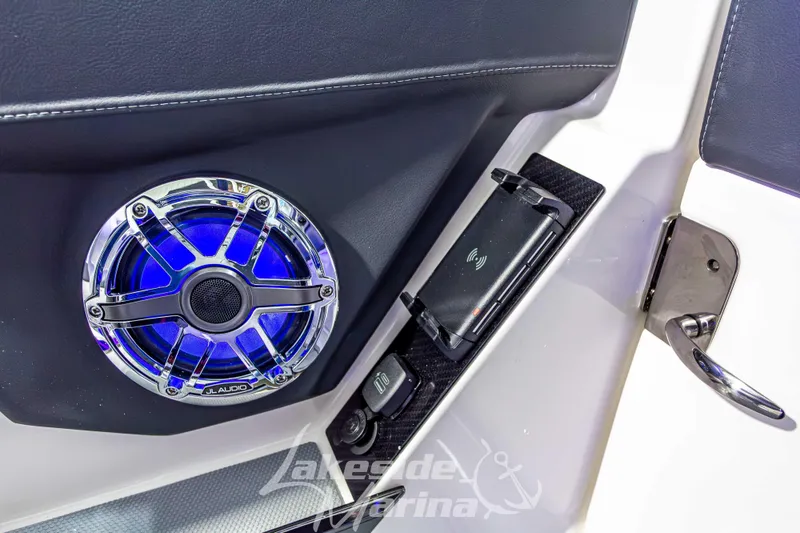 Slide: The Image of 2026 Chaparral SSX 6 interior with JL Audio speaker and wireless charging dock. - 25