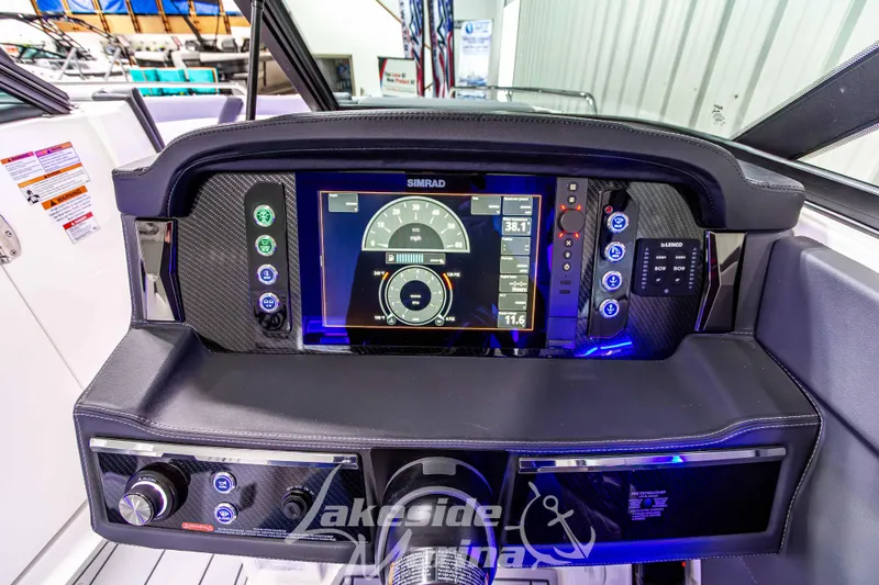Slide: The Image of 2026 Chaparral SSX 6 dashboard with Simrad display and modern controls. - 19