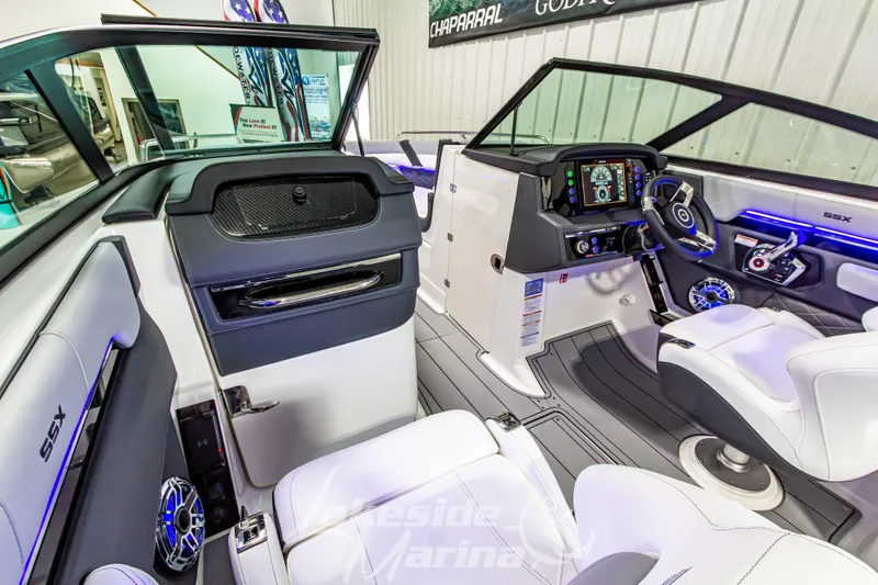 Slide: The Image of 2026 Chaparral SSX 6 boat interior with modern dashboard and luxurious seating. - 23