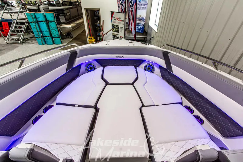 Slide: The Image of 2026 Chaparral SSX 6 boat interior with luxurious seating and ambient lighting at Lakeside Marina. - 31