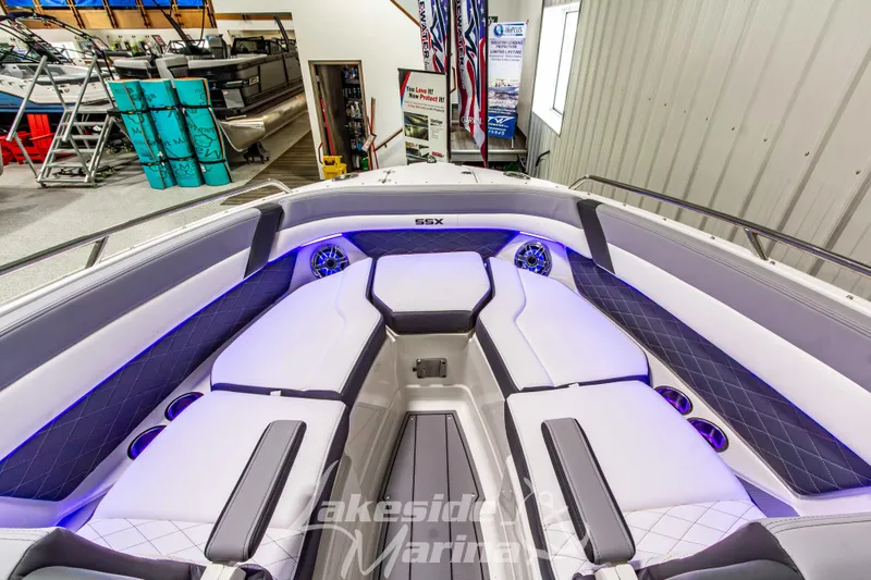 Slide: The Image of 2026 Chaparral SSX 6 boat interior with luxurious seating and ambient lighting. - 30