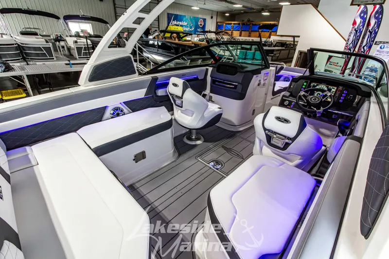 Slide: The Image of 2026 Chaparral SSX 6 boat interior with modern seating and advanced dashboard controls. - 12