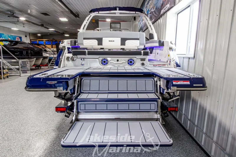Slide: The Image of 2026 Chaparral SSX 6 boat in showroom, featuring extended swim platform and sleek design. - 6