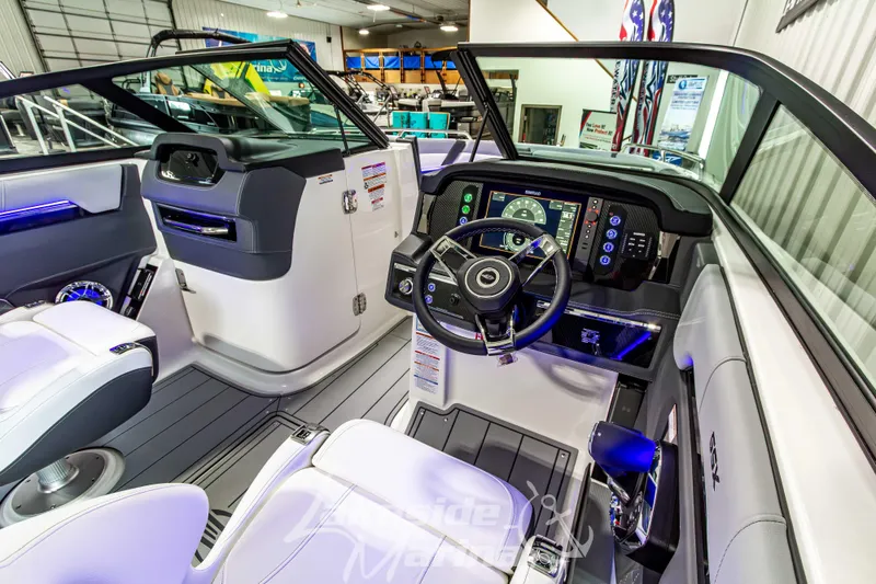 Slide: The Image of Interior of 2026 Chaparral SSX 6 boat, featuring modern dashboard and steering wheel. - 17