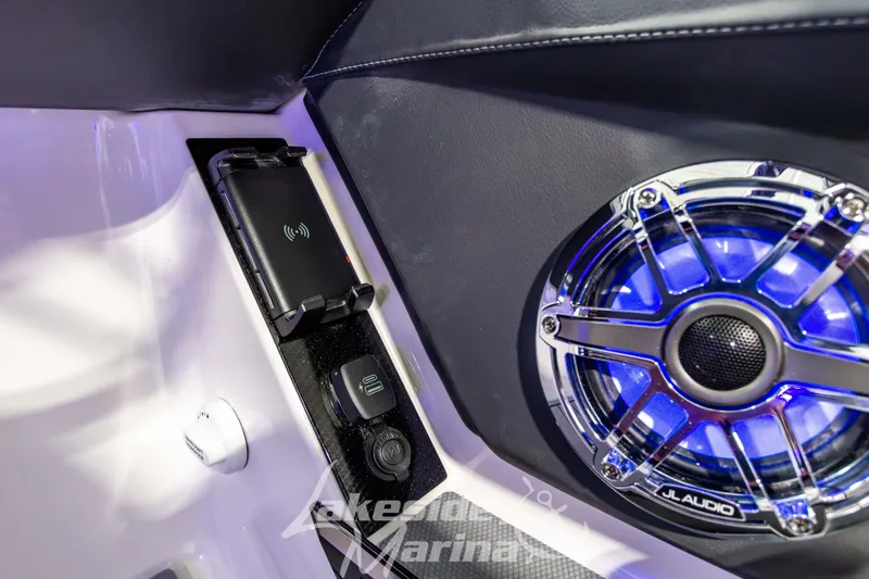 Slide: The Image of 2026 Chaparral SSX 6 interior with wireless charger and JL Audio speaker. - 21