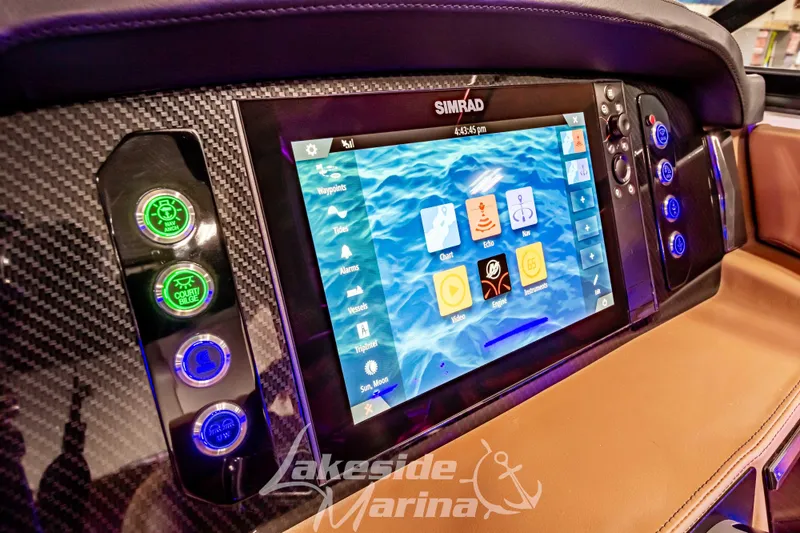 Slide: The Image of 2026 Chaparral SSX 6 dashboard with Simrad touchscreen and control buttons. - 14