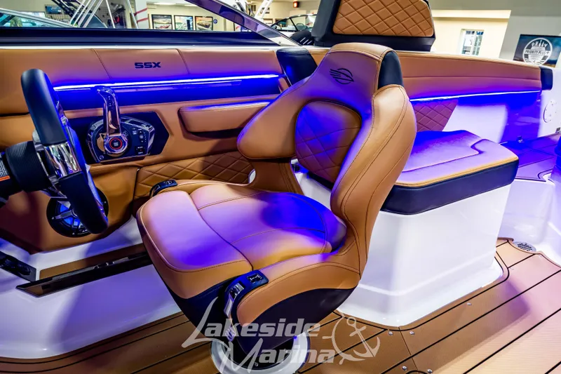 Slide: The Image of Luxurious interior of 2026 Chaparral SSX 6 boat with leather seating and ambient lighting. - 15