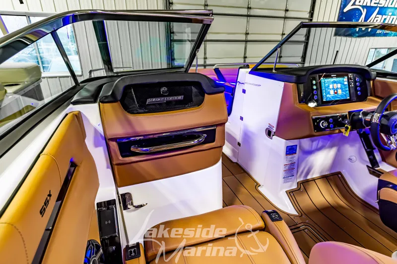 Slide: The Image of Interior of 2026 Chaparral SSX 6 boat with modern dashboard and luxurious seating. - 18