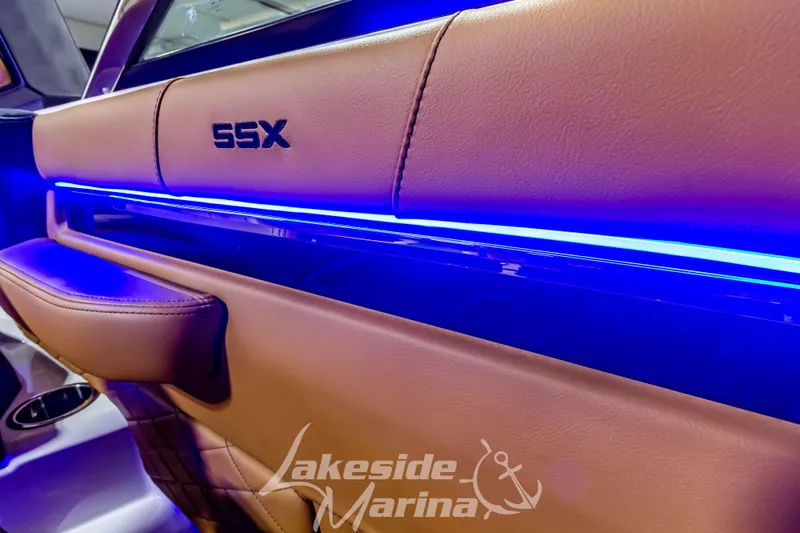 Slide: The Image of 2026 Chaparral SSX 6 interior with blue LED lighting and leather detailing. - 23