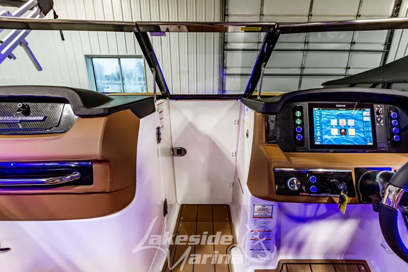 Slide: The Image of 2026 Chaparral SSX 6 boat dashboard with advanced navigation system and luxurious interior. - 25