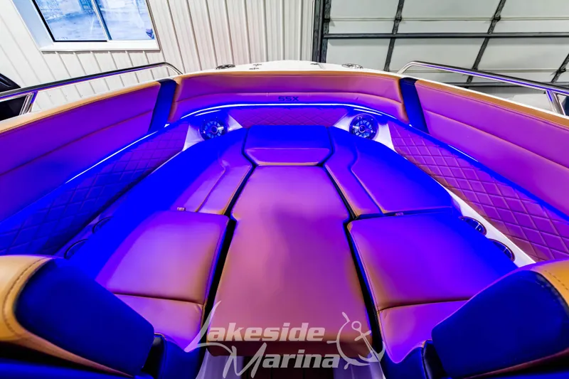 Slide: The Image of Luxurious interior of 2026 Chaparral SSX 6 boat with ambient blue lighting. - 29