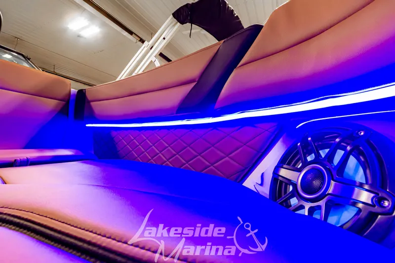 Slide: The Image of Interior of 2026 Chaparral SSX 6 boat with blue LED lighting and speaker system. - 32
