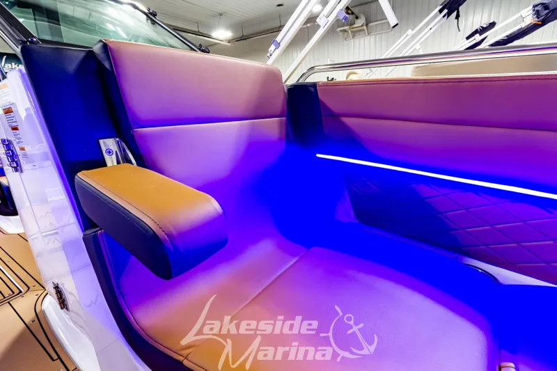 Slide: The Image of Luxurious seating in 2026 Chaparral SSX 6 boat with ambient blue lighting. - 34