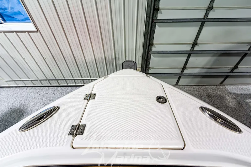 Slide: The Image of 2026 Chaparral SSX 6 boat deck in a garage setting. - 35