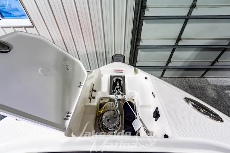 Slide: The Image of 2026 Chaparral SSX 6 boat anchor compartment in a garage setting. - 36