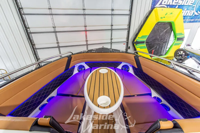 Slide: The Image of 2026 Chaparral SSX 6 boat interior with elegant seating and ambient lighting. - 37