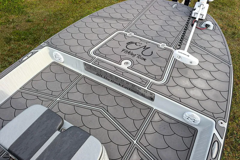 Slide: The Image of 2014 SCB Stingray Sport 25 boat deck with custom fishing team design and scale pattern. - 11