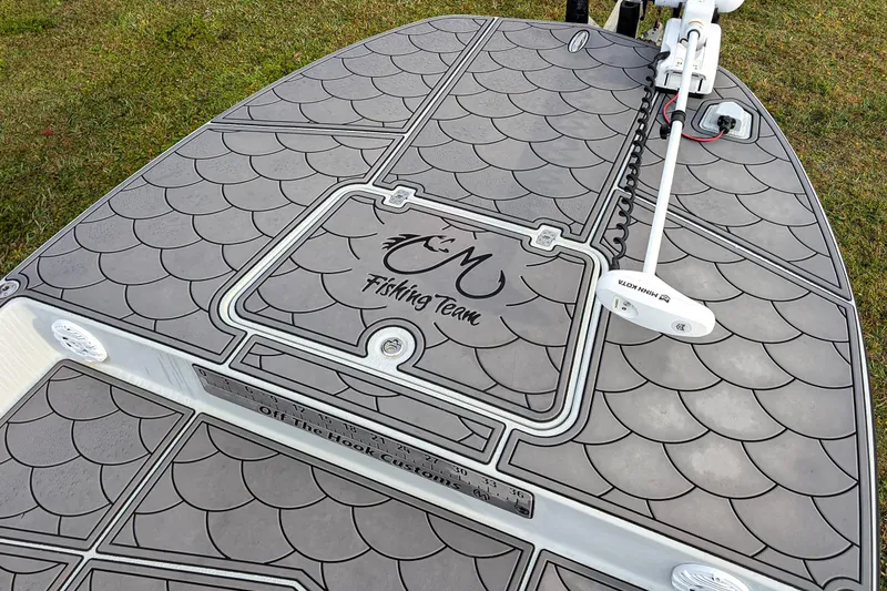 Slide: The Image of 2014 SCB Stingray Sport 25 boat deck with custom fishing team design. - 12