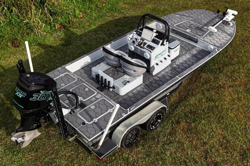 Slide: The Image of 2014 SCB Stingray Sport 25 boat on grass, featuring sleek design and modern equipment. - 18