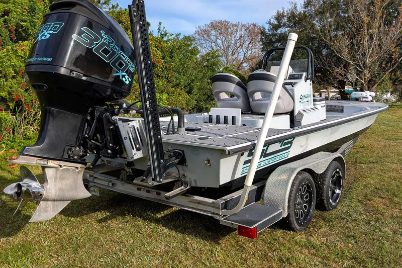 Slide: The Image of 2014 SCB Stingray Sport 25 boat on trailer with powerful outboard motor. - 3