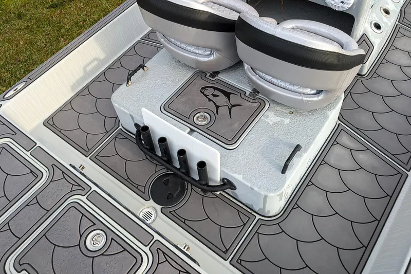 Slide: The Image of 2014 SCB Stingray Sport 25 boat interior with fish-themed deck design and seating. - 7