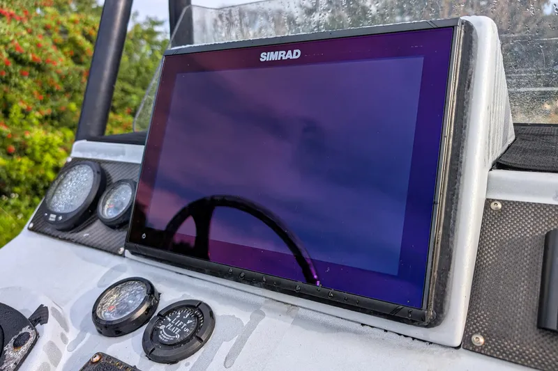 Slide: The Image of Dashboard of 2014 SCB Stingray Sport 25 with Simrad display and gauges. - 9