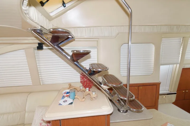 Slide: The Image of Luxurious interior of 2001 Sea Ray 540 Cockpit Motor Yacht with elegant staircase. - 14