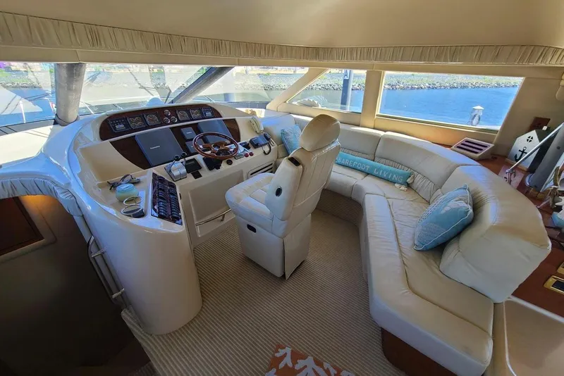 Slide: The Image of Luxurious interior of 2001 Sea Ray 540 Cockpit Motor Yacht with plush seating and helm. - 19