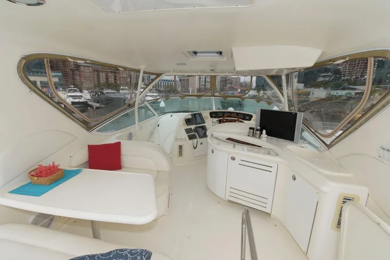 Slide: The Image of Luxurious interior of 2001 Sea Ray 540 Cockpit Motor Yacht with helm and seating area. - 29