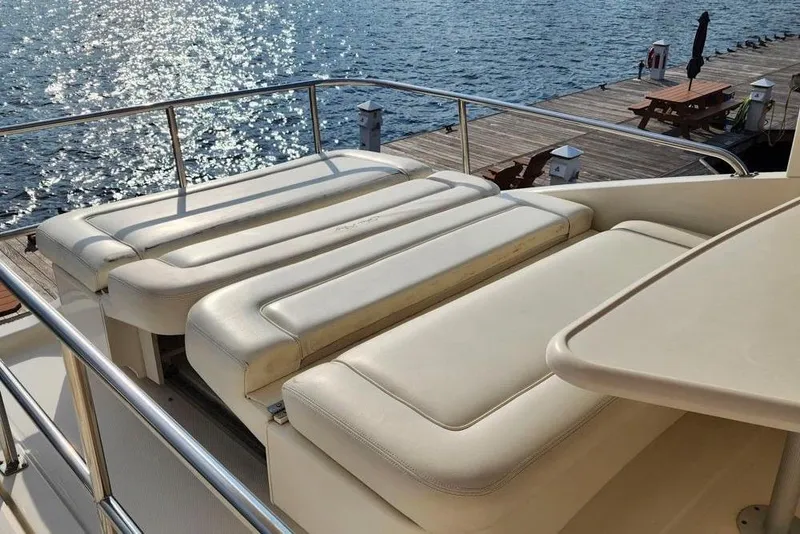 Slide: The Image of 2001 Sea Ray 540 Cockpit Motor Yacht with sunlit deck and comfortable seating. - 31