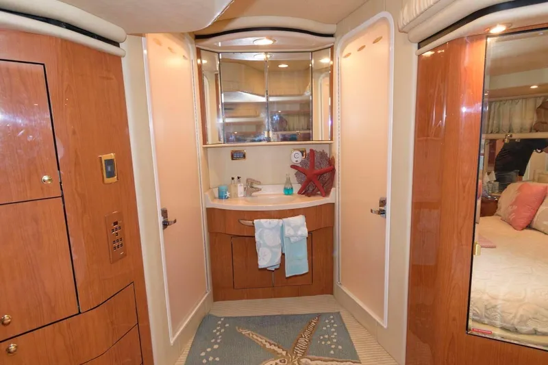 Slide: The Image of Luxurious bathroom interior of 2001 Sea Ray 540 Cockpit Motor Yacht with wood accents. - 36