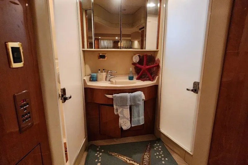 Slide: The Image of Luxurious bathroom in 2001 Sea Ray 540 Cockpit Motor Yacht with elegant decor. - 37