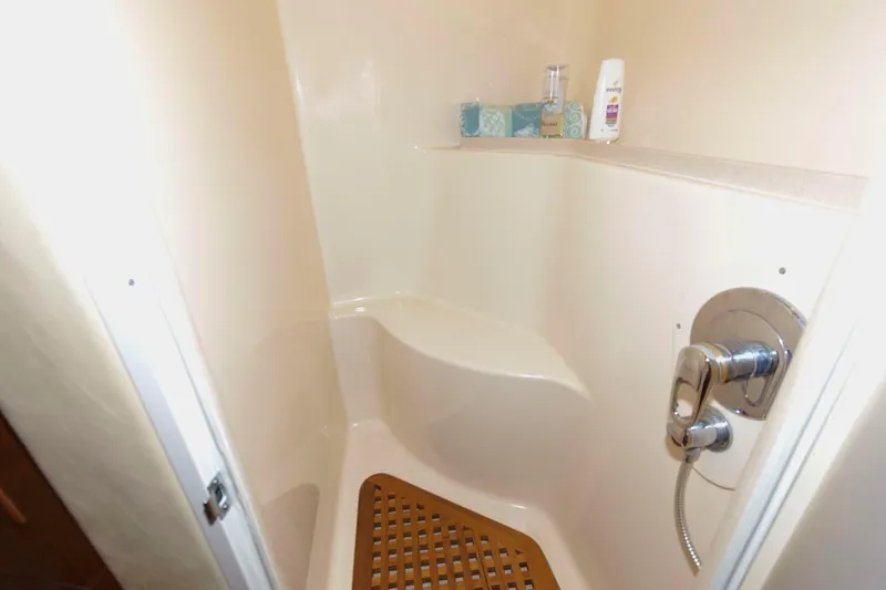 Slide: The Image of Shower area in 2001 Sea Ray 540 Cockpit Motor Yacht with wooden mat and toiletries. - 38