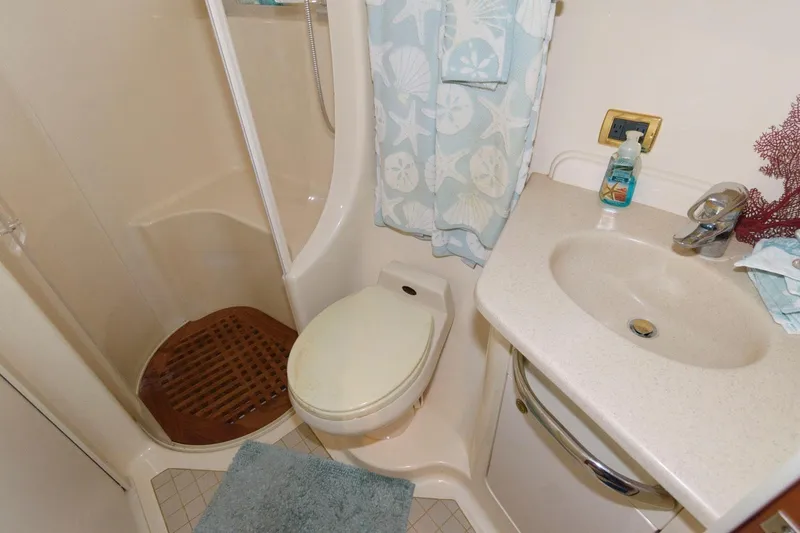 Slide: The Image of Bathroom of 2001 Sea Ray 540 Cockpit Motor Yacht with shower, toilet, and sink. - 42