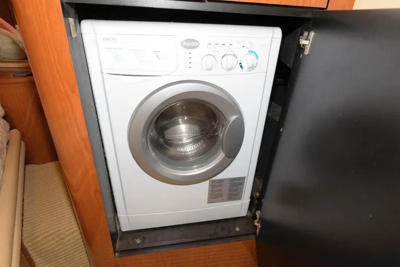 Slide: The Image of Washing machine inside 2001 Sea Ray 540 Cockpit Motor Yacht's wooden cabinet. - 43