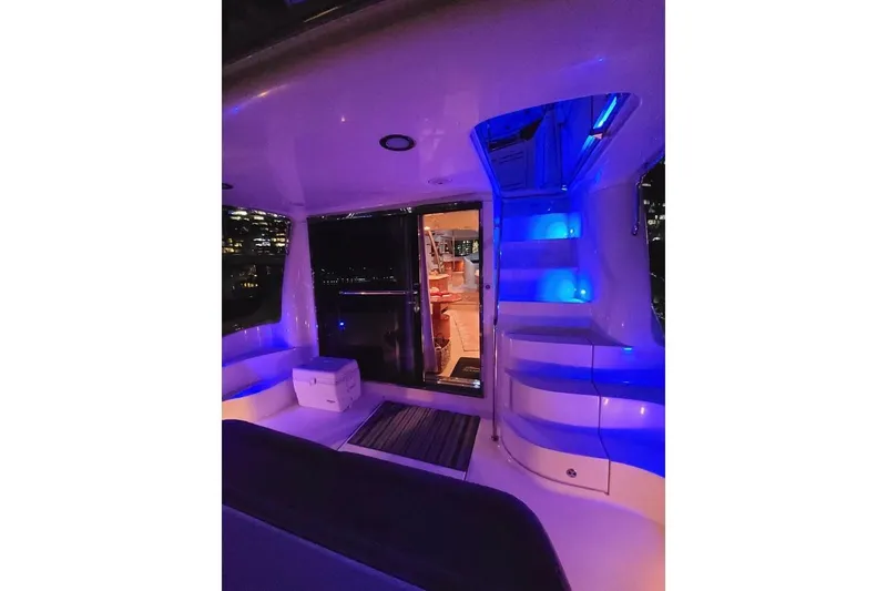Slide: The Image of Luxurious 2001 Sea Ray 540 Cockpit Motor Yacht interior with ambient blue lighting. - 6