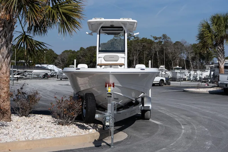 Slide: The Image of 2026 Caymas 28 HB boat on trailer in sunny outdoor setting. - 3